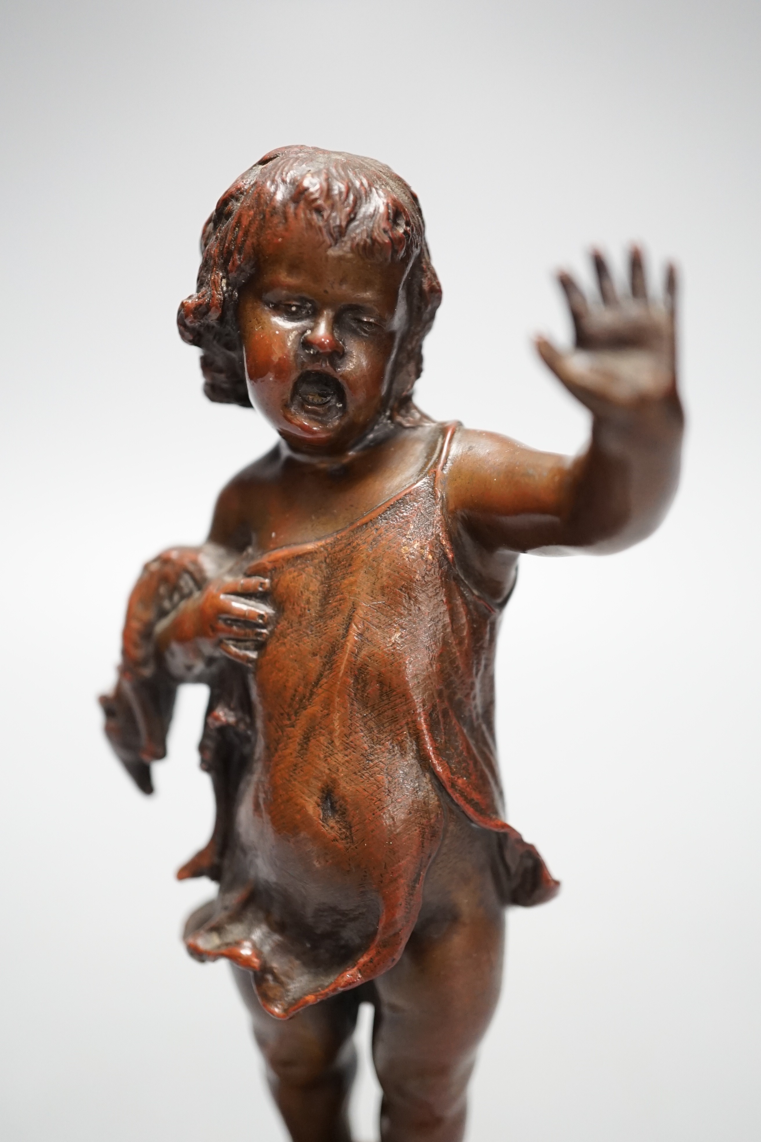 Franz Iffland (German, 1862-1935), bronze of a child holding a Punch puppet, dated 1886 20cm